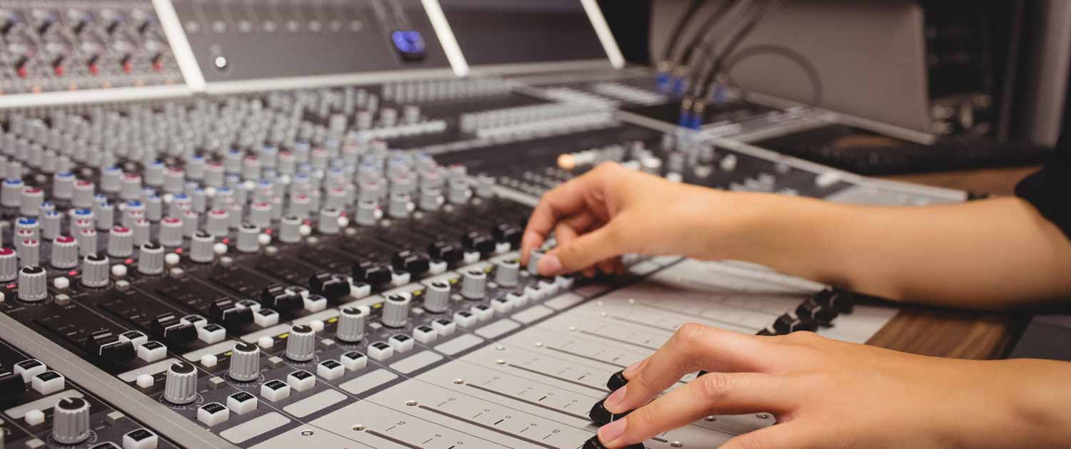 Audio Engineer Using Mixer